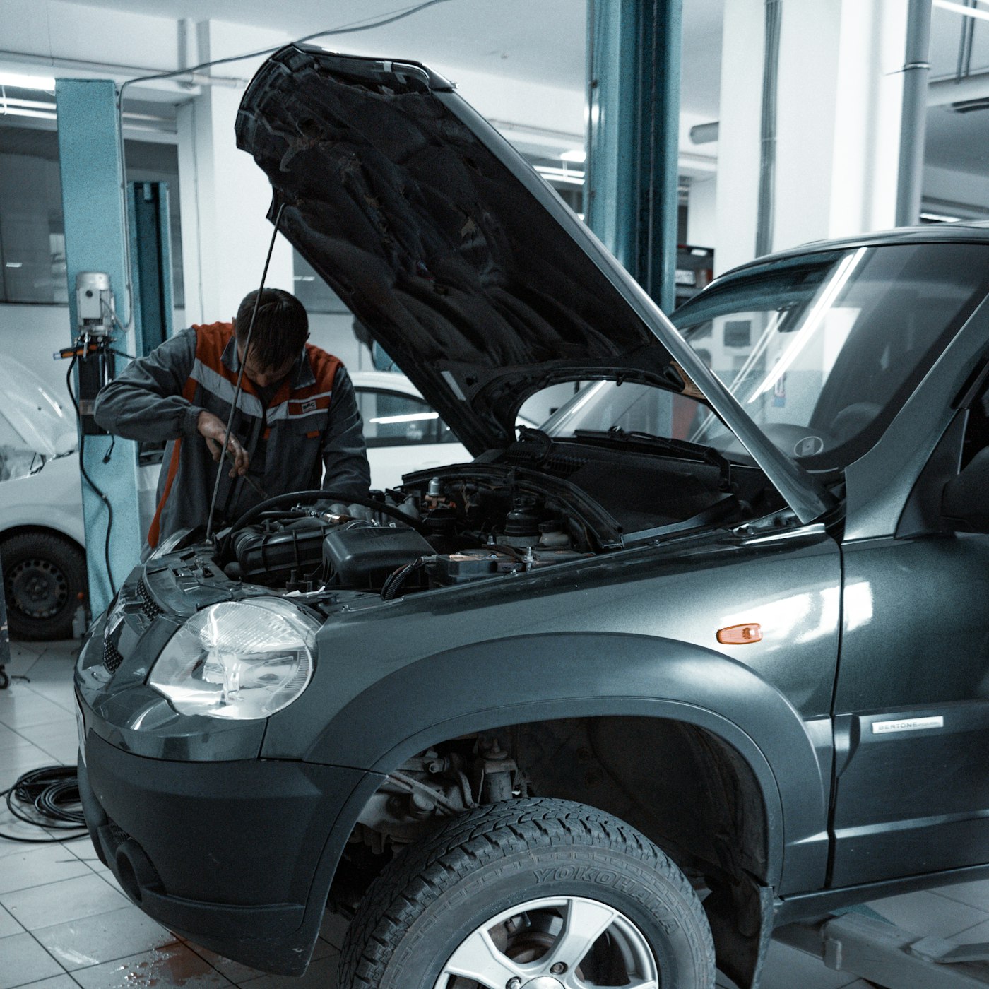Mechanic servicing a car engine